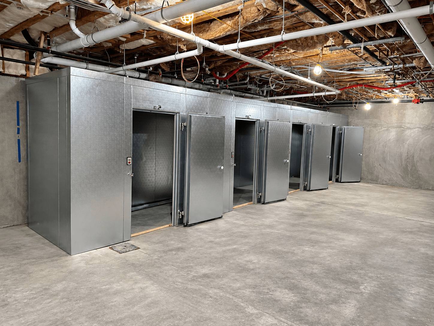Row of Coldrite walk-in cooler and freezer units