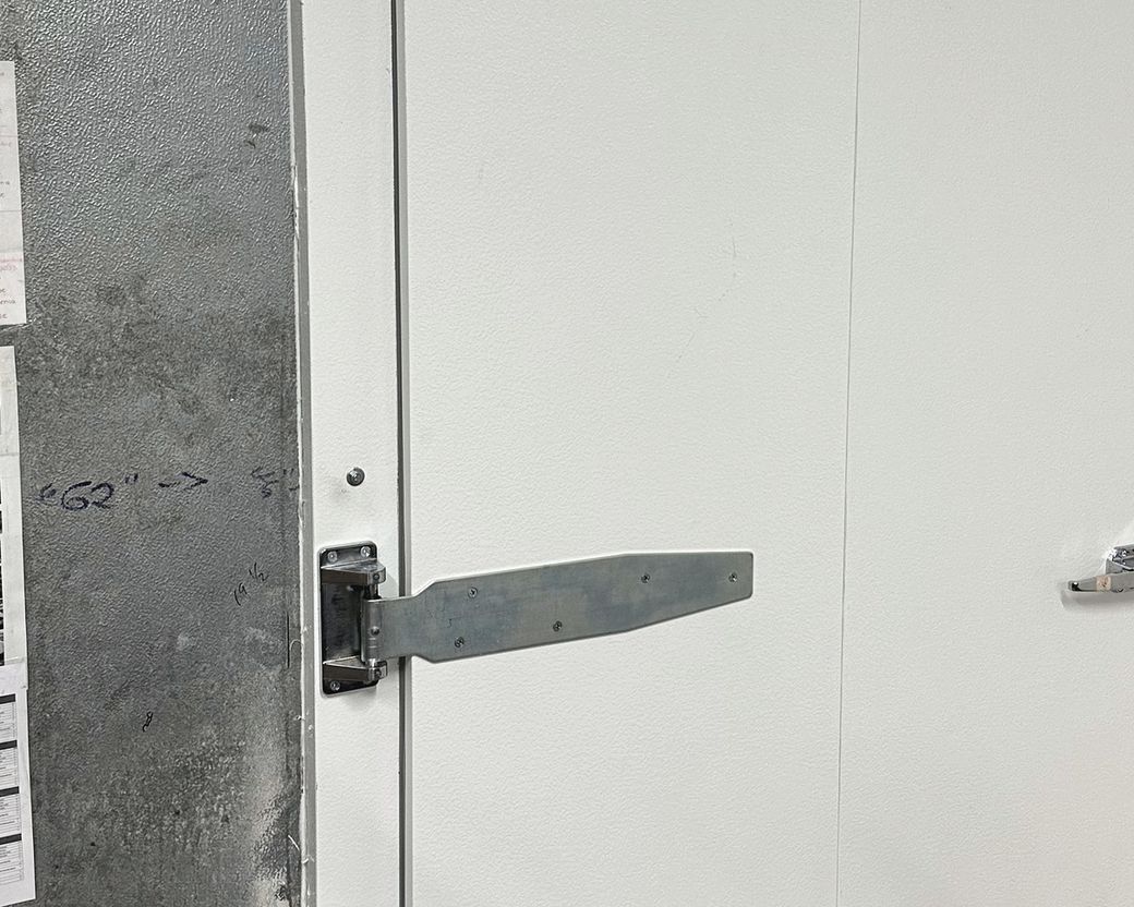 Heavy-duty hinge on a Coldrite walk-in cooler door